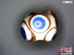 辽宁科技考古确认战国墓内7枚“蜻蜓眼”真实身